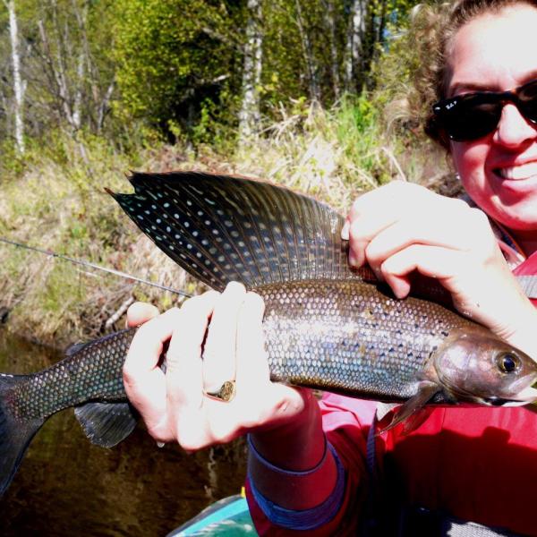 a person holding a fish