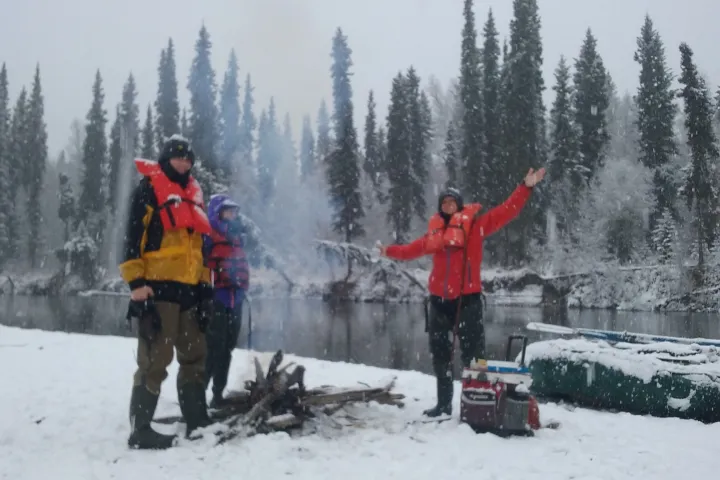 a person standing on top of a snow covered slope