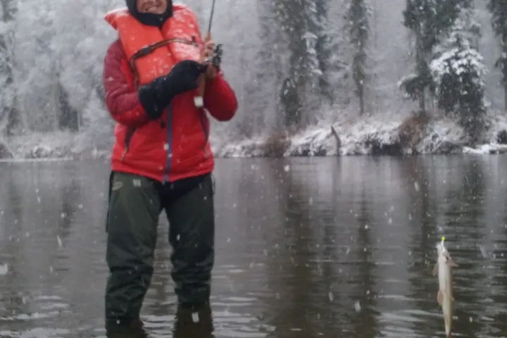 a man that is standing in the water