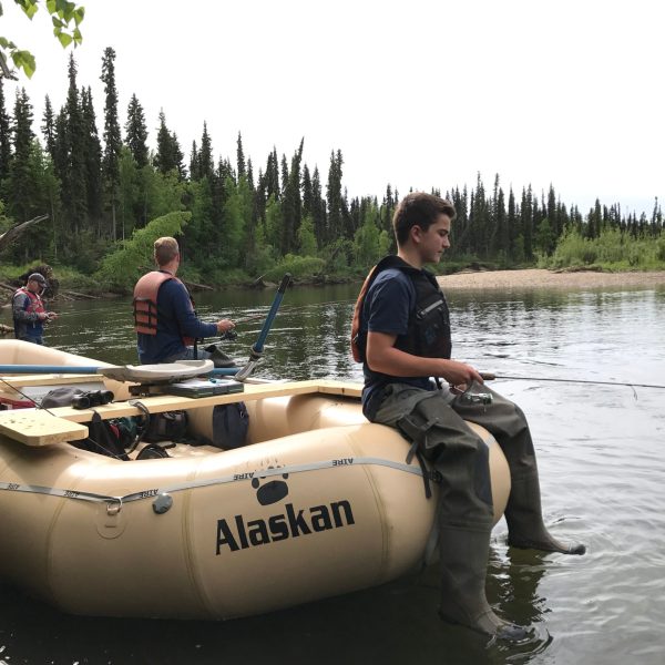 a group of people on a boat in the water