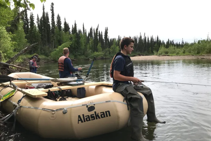 a group of people on a boat in the water