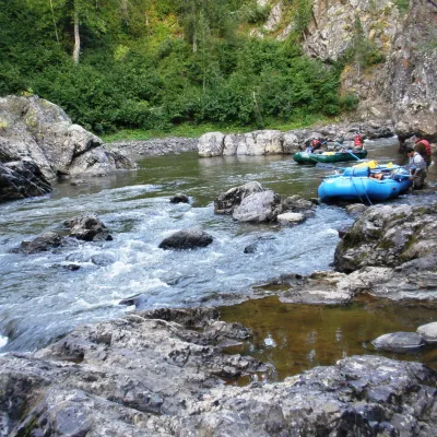 a close up of a rock next to a body of water