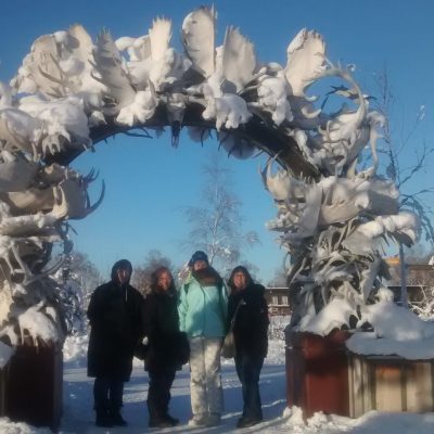 a group of people that are standing in the snow