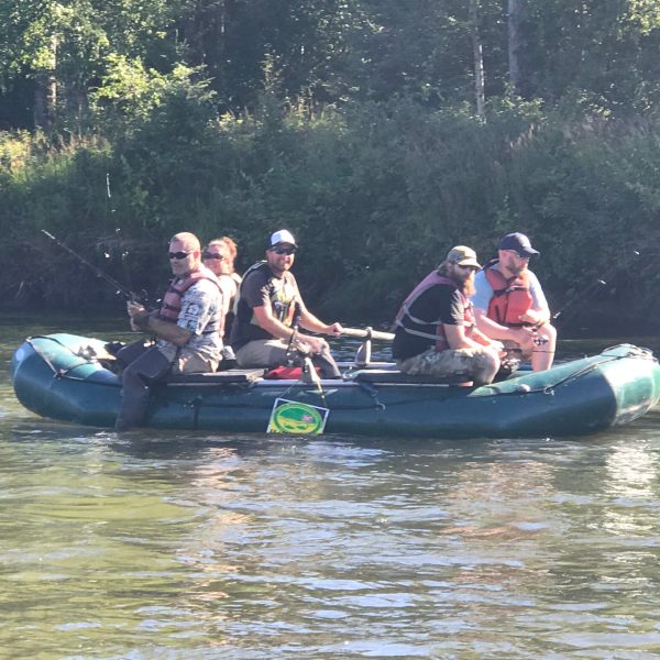 a group of people riding on the back of a boat