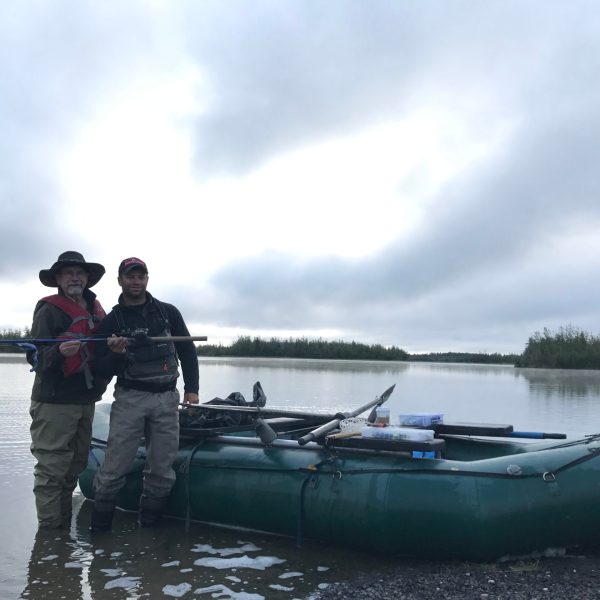 a group of people in a boat on a body of water
