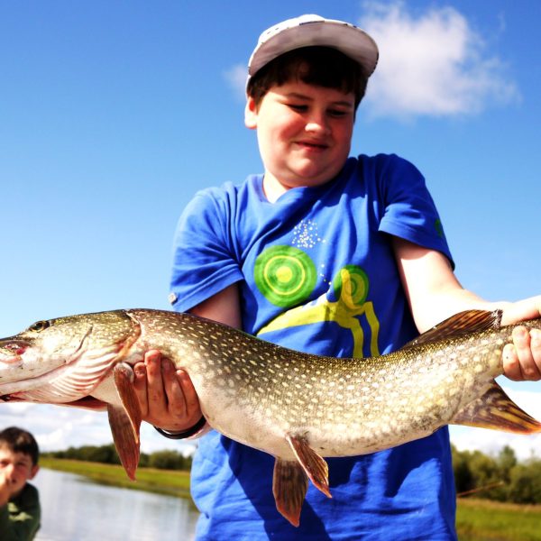 a person holding a fish