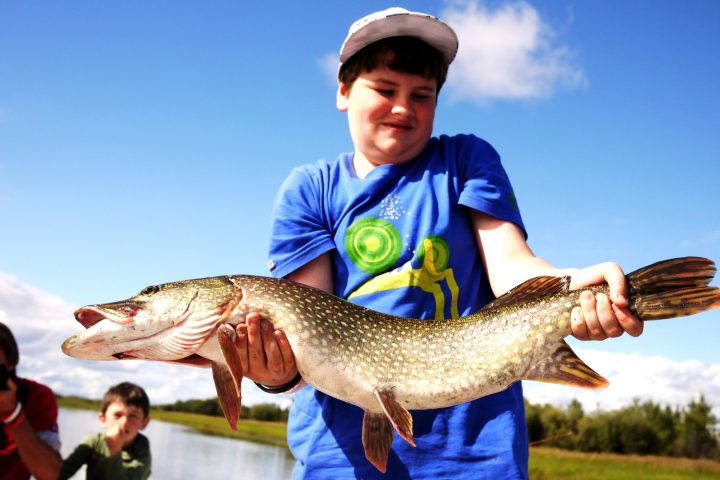 a person holding a fish