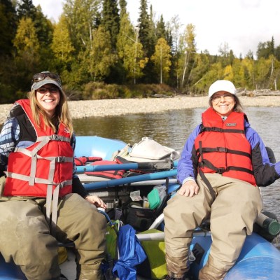 a group of people sitting on a boat