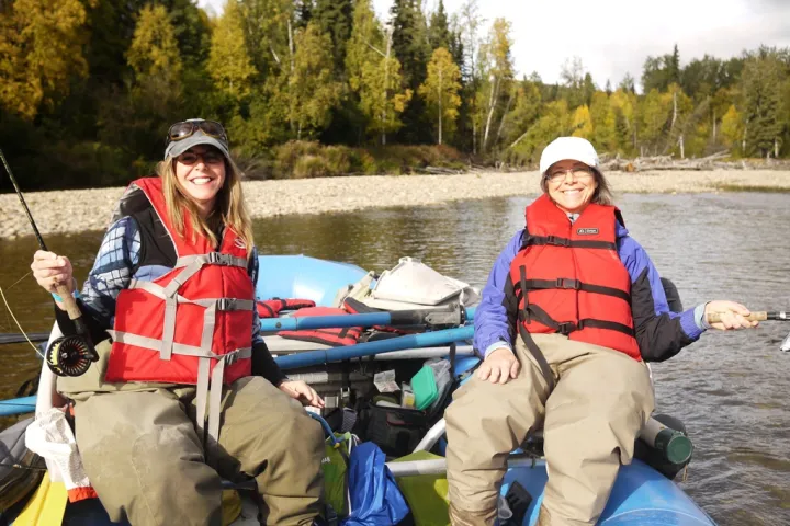 a group of people sitting on a boat