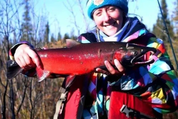 a person holding a fish
