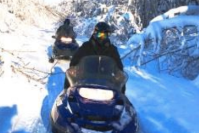 a couple of people that are standing in the snow