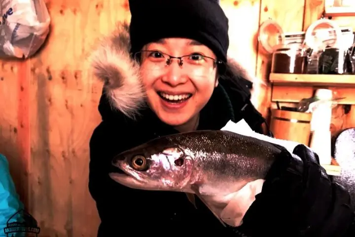 a person holding a fish
