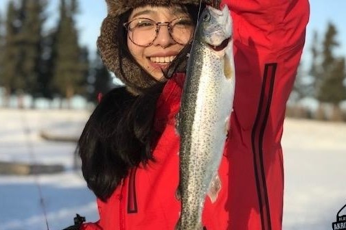 a person holding a fish