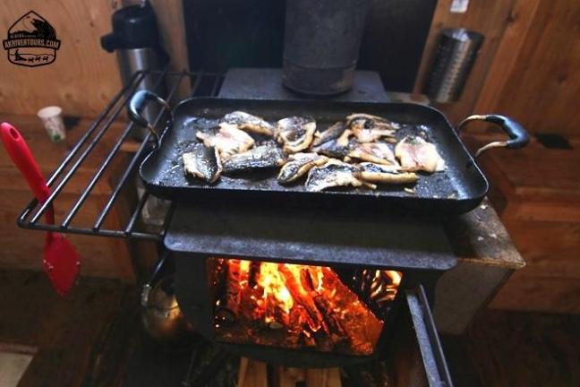a pizza sitting on top of a pan on a stove top oven