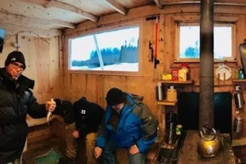 a group of people standing in a room