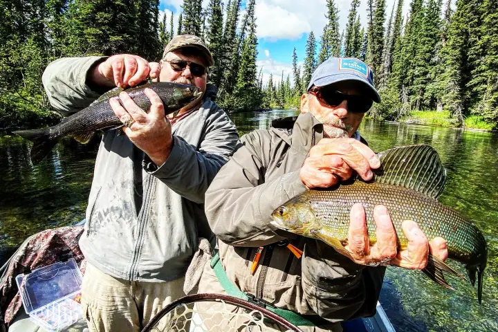 a person holding a fish