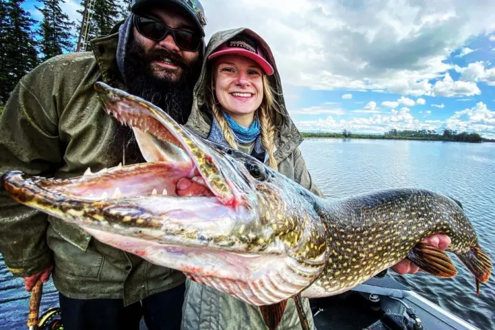 a person holding a fish
