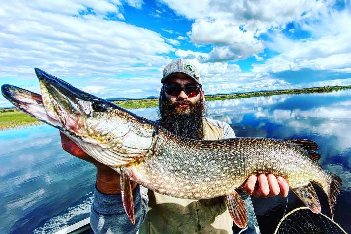 a person holding a fish
