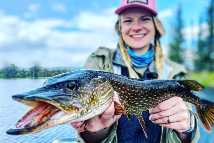 a person holding a fish