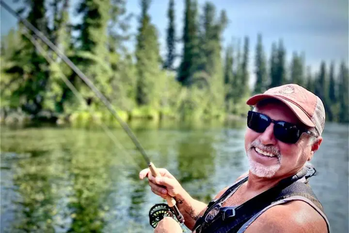 a man riding on top of a lake