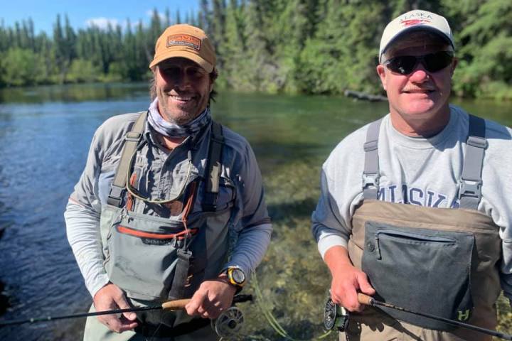 a man holding a fish