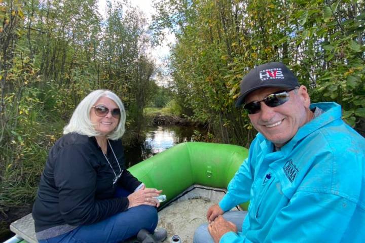 a couple of people that are sitting on a bench