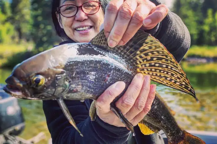 a man holding a fish