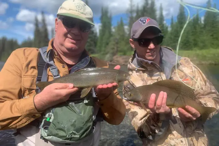 a person holding a fish
