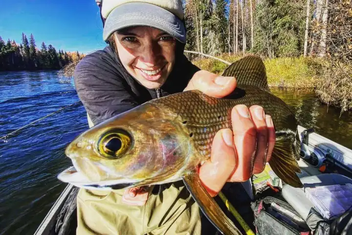 a person holding a fish