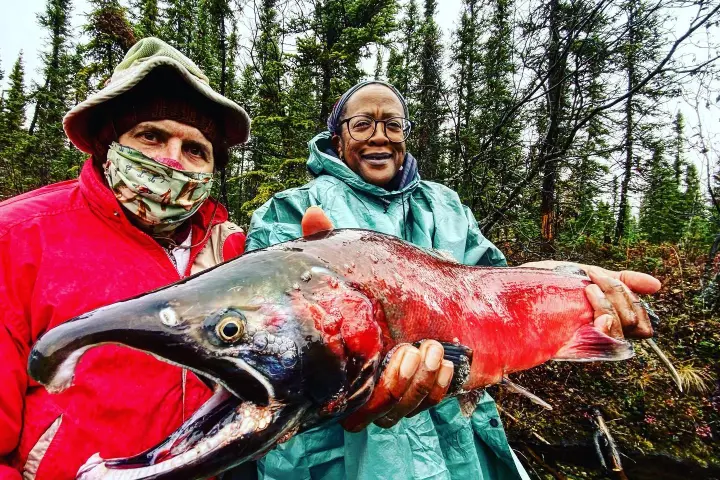 a person holding a fish