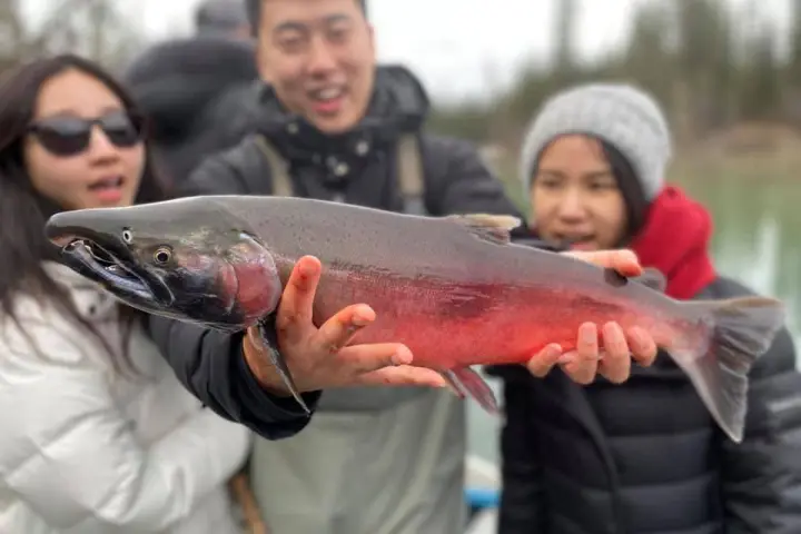 a man holding a fish