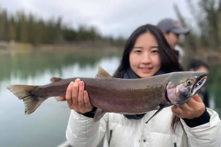 a person holding a fish