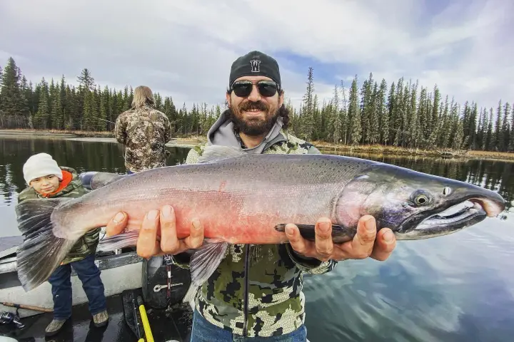 a man holding a fish