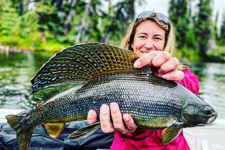 a person holding a fish