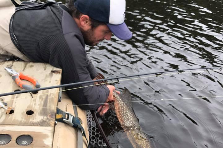 a person sitting on a boat in the water
