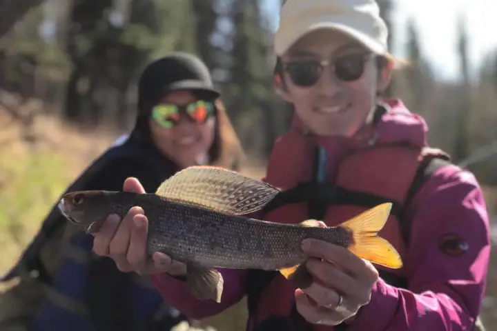 a person holding a fish