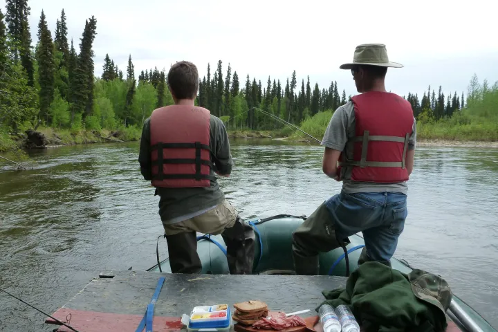 a man in a raft on the water