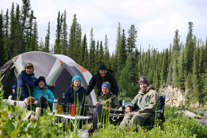 a group of people sitting in a tree