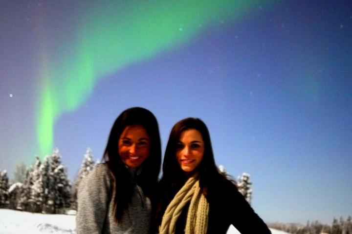 a couple of people that are standing in the snow