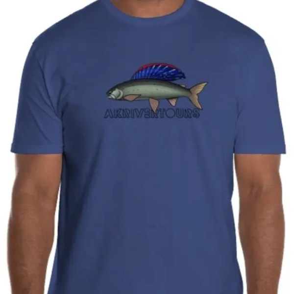 Man in blue t-shirt with fish illustration and 'AKDRIVERTOURS' text.