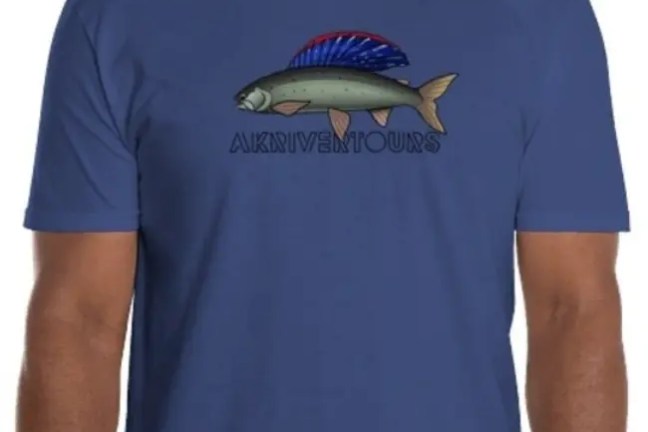 Man in blue t-shirt with fish illustration and 'AKDRIVERTOURS' text.